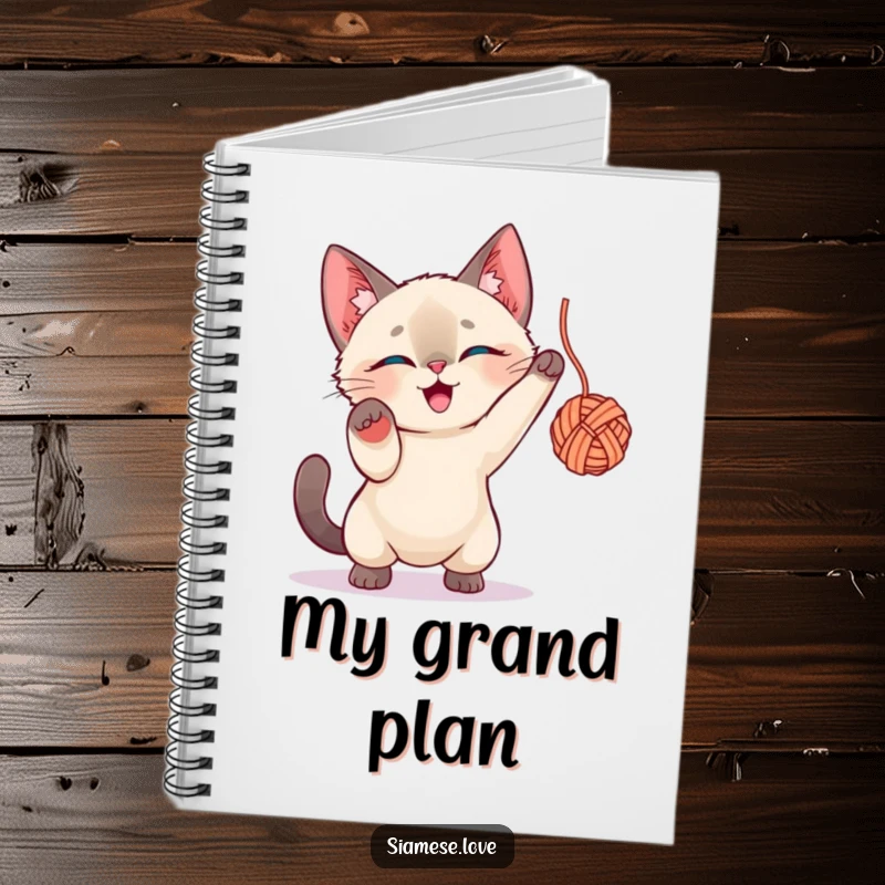 Funny Siamese Cat Notebook: A playful cat character energetically batting at a ball of yarn, perfect for note-taking.