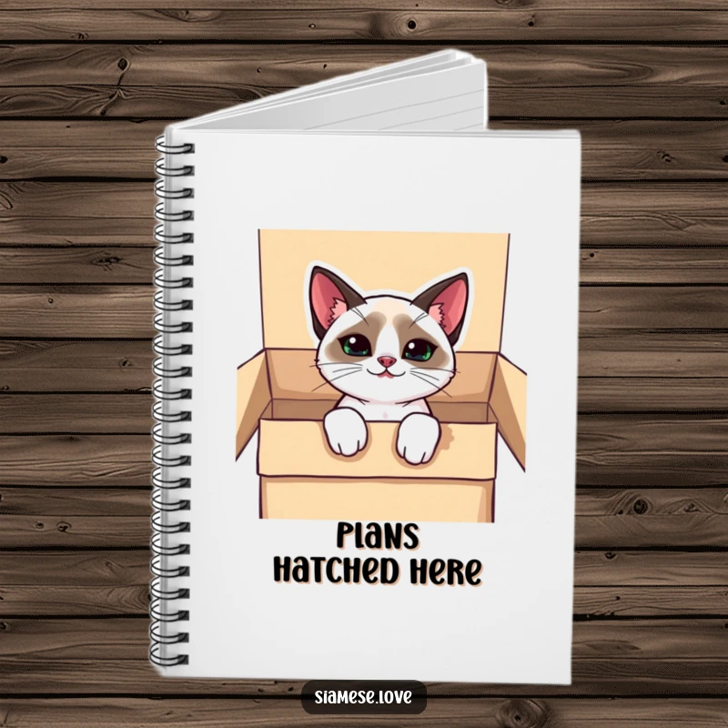 Funny kawaii Siamese cat notebook, peeking from a box with a mischievous grin, perfect for writing down ideas.