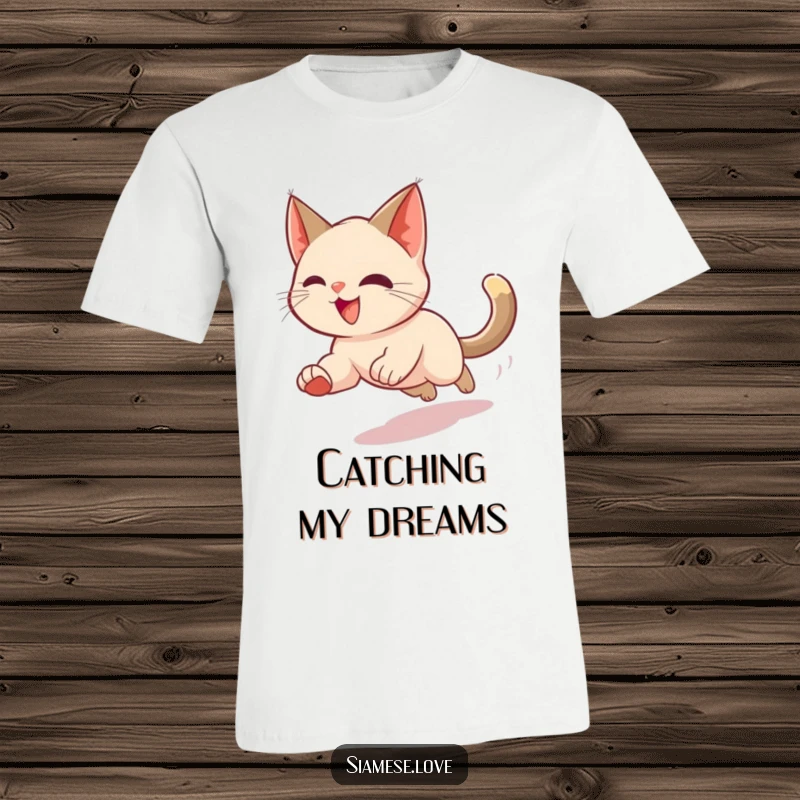 Funny t-shirt depicting a Siamese cat in a dizzying blur as it chases its tail, capturing a moment of pure, exhilarating fun.