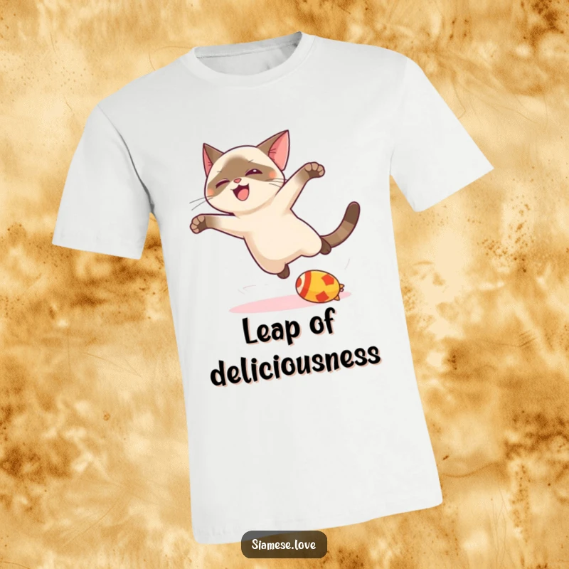 Funny kawaii Siamese cat t-shirt, capturing a dynamic leap towards a toy, embodying playful energy and feline grace.