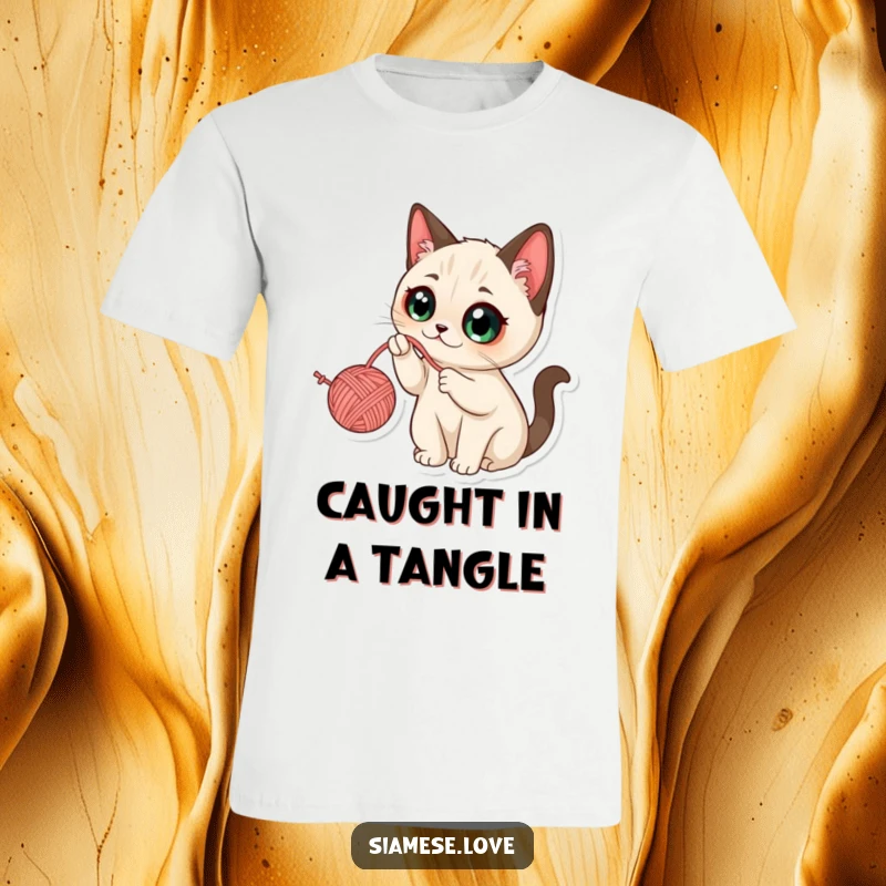 Funny Kawaii Siamese Cat T-Shirt: Expressive cat with big eyes, enthusiastically batting at a dangling yarn ball.