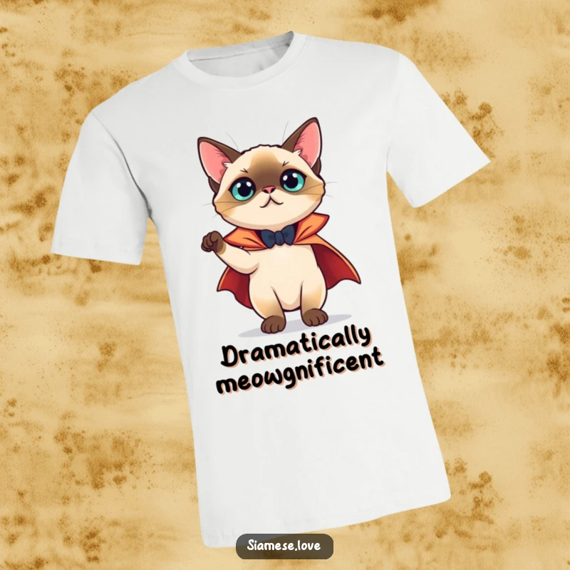 Funny T-Shirt: A Siamese cat heroically wearing a tiny cape and striking a theatrical, funny pose with style.