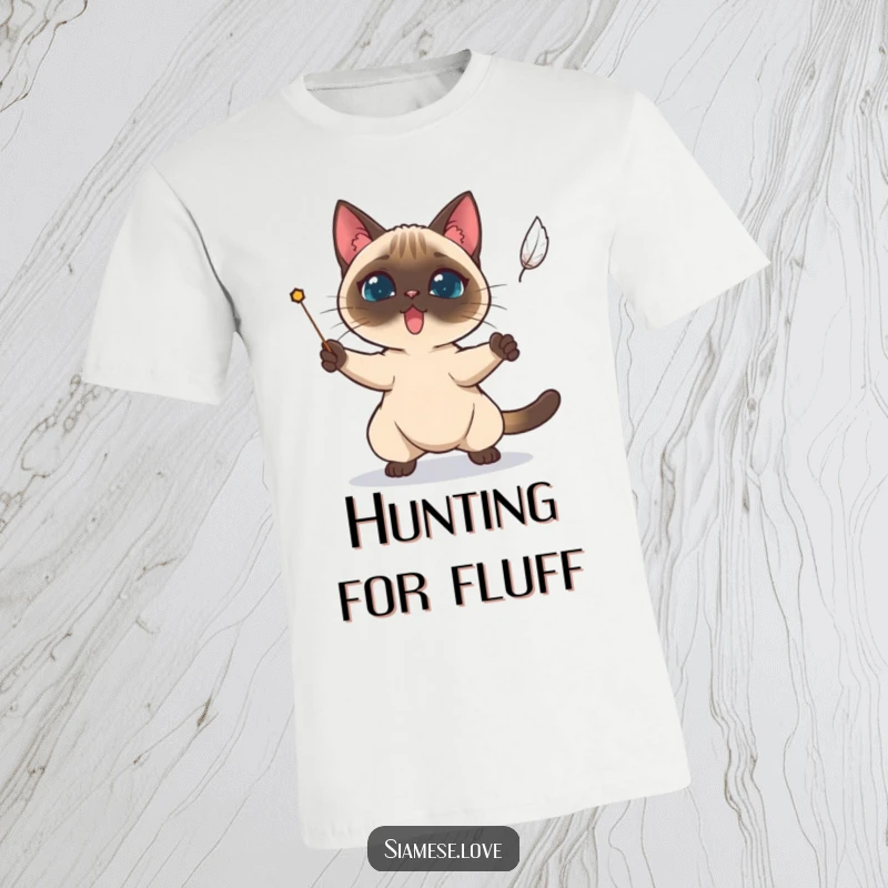 Funny Siamese cat character determinedly trying to catch a falling feather on a t-shirt.
