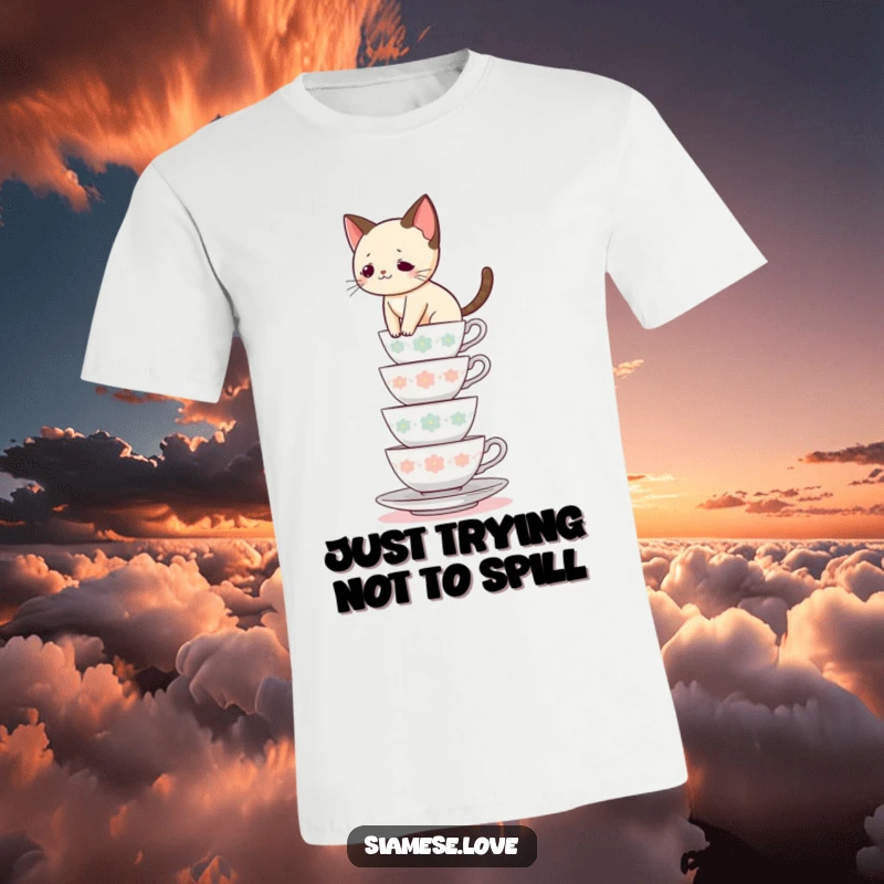 Funny Siamese cat t-shirt, feline balancing act on a precarious teacup tower, playful and daring, great funny gift.