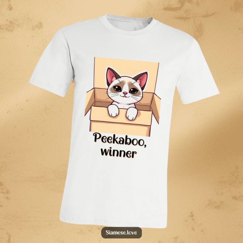 Funny kawaii Siamese cat t-shirt, peeking out of a box with a mischievous grin, embodying playful curiosity.