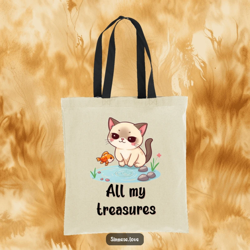 Funny Siamese cat tote bag, smugly catching a falling fish from a tiny pond, a stylish and humorous accessory for cat lovers.