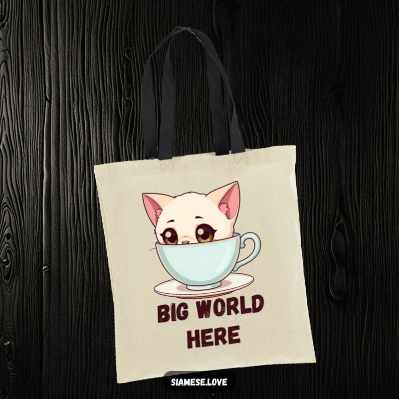 Funny Siamese Cat Tote Bag: A wide-eyed Siamese cat character curiously peeking into a giant teacup.