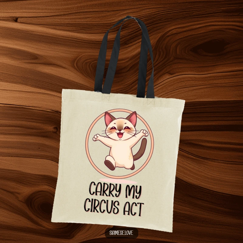 Funny tote bag featuring a cheerful Siamese cat joyfully leaping through a hoop, showcasing agility and happiness.