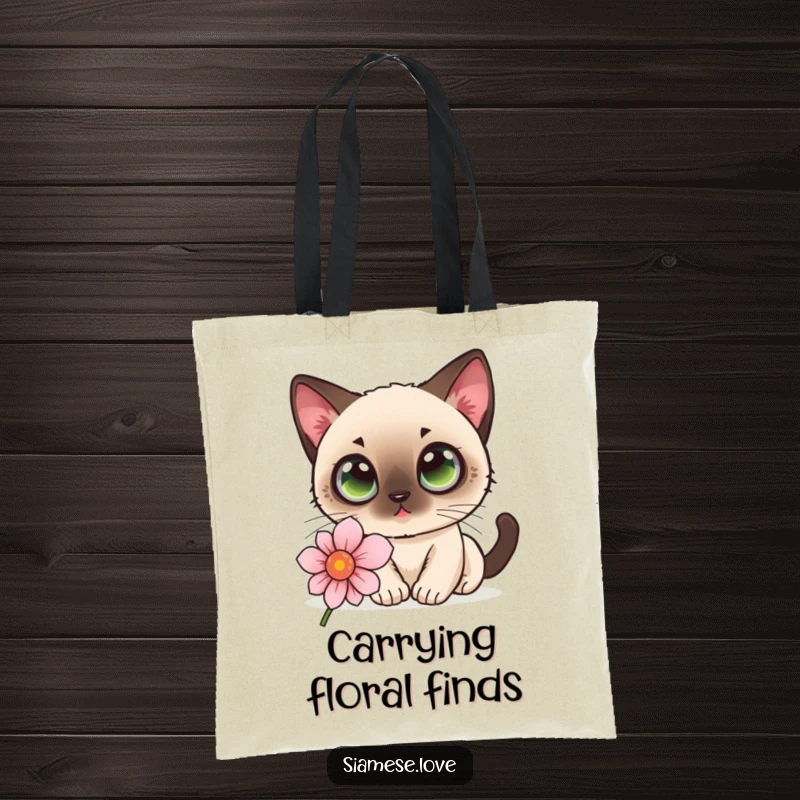 Funny kawaii Siamese cat with curious wide eyes sniffing a flower on a tote bag, ready for errands.