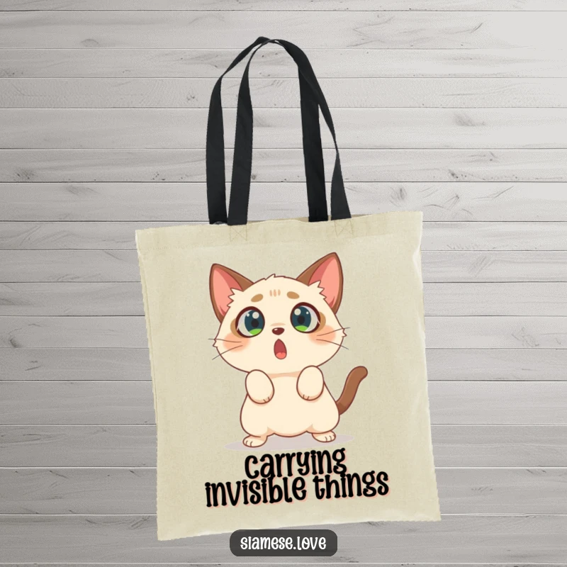 Funny tote bag featuring a surprised Siamese cat with wide eyes, caught in the act of pouncing on nothing.