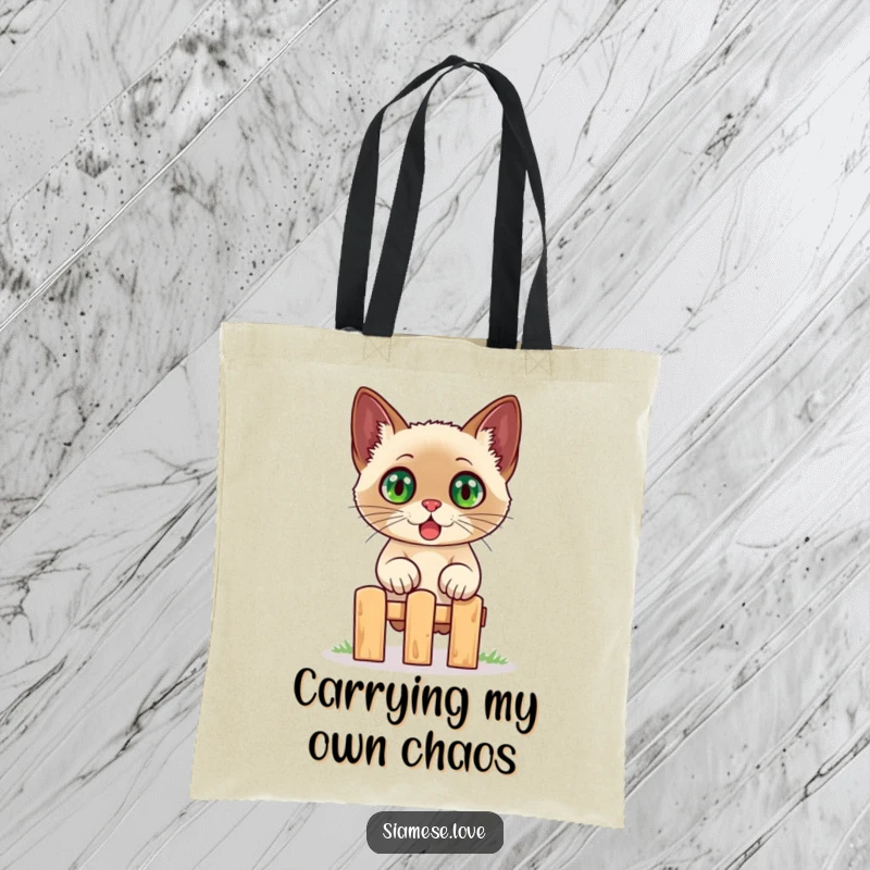 Funny Siamese cat tote bag, showing a startled cat with huge eyes leaping over a tiny fence, perfect for carrying humor.