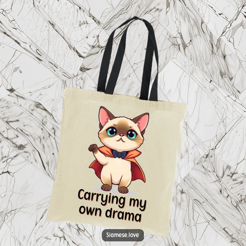 Funny Tote Bag: A Siamese cat in a cape striking a dramatic, theatrical pose, ready for an adventure.