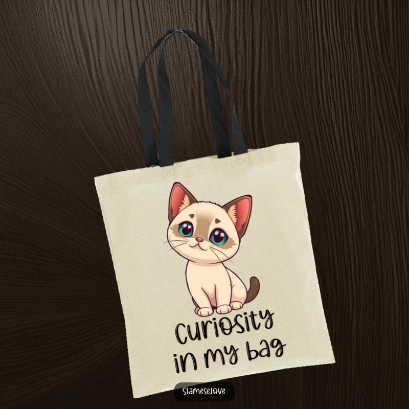 Funny kawaii Siamese cat tilting its head with intrigue on a tote bag, perfect for everyday pondering.