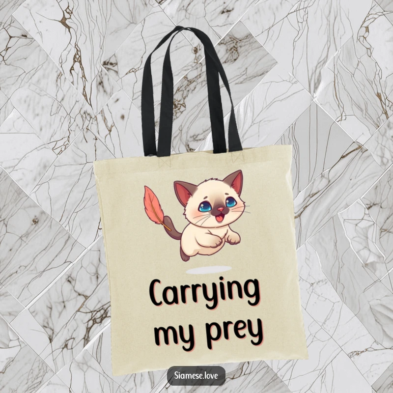 Funny Kawaii Siamese cat on a spirited chase after a feather toy, captured on a durable tote bag.