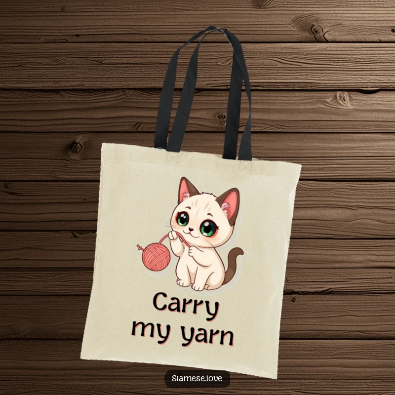 Funny Kawaii Siamese Cat Tote Bag: Cute tote featuring a wide-eyed cat batting at a dangling ball of yarn.