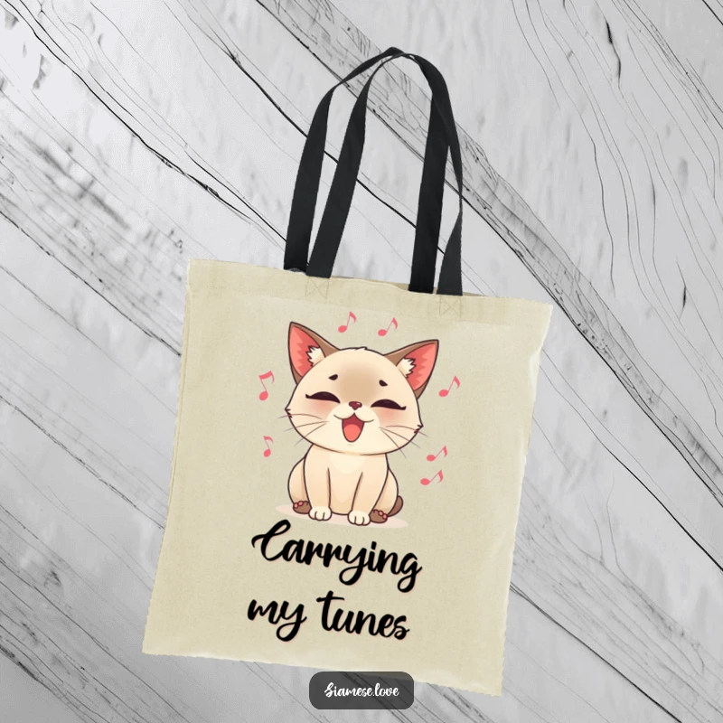 Funny tote bag with a content Siamese cat character purring loudly, surrounded by floating musical notes, exuding charm and melody.