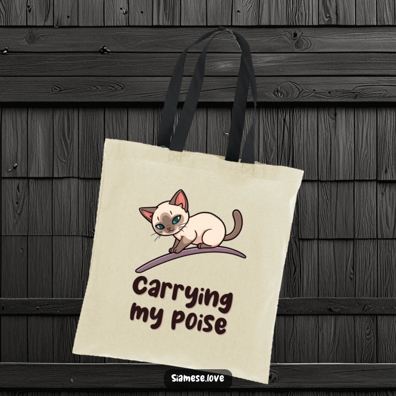 Funny tote bag featuring a stylized Siamese cat elegantly balancing on a narrow, curving surface, perfect for carrying items with sophisticated humor.