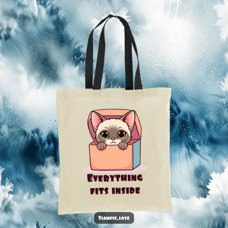 Funny tote bag featuring a stylized Siamese cat with curious eyes peeking out of a colorful oversized box, perfect for humorous flair.