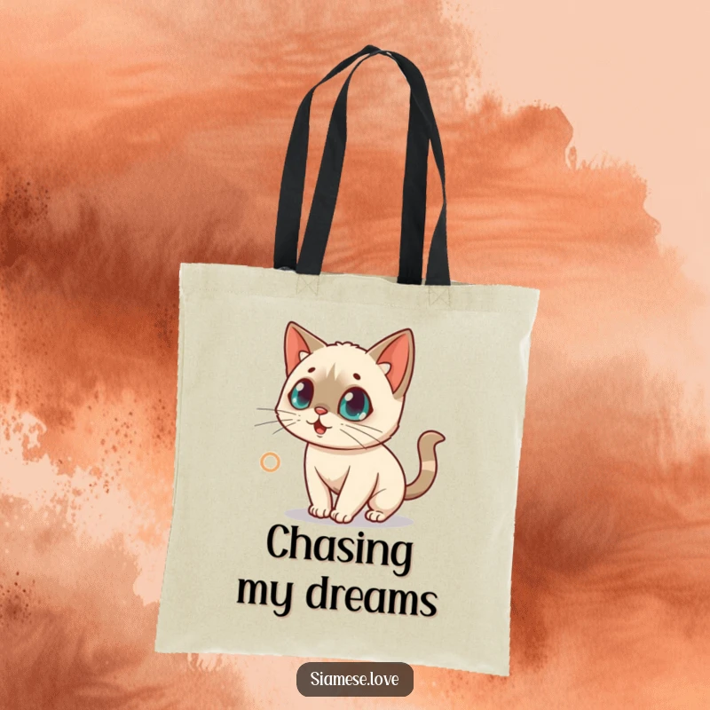 Funny tote bag with a surprised kawaii Siamese cat chasing a red laser dot, symbolizing playful obsession.