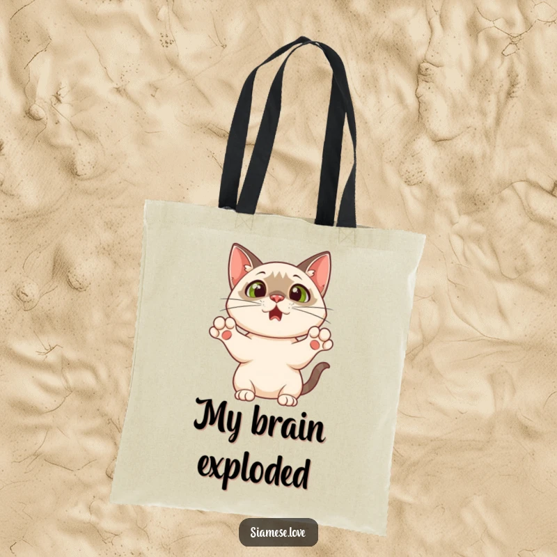 Funny tote bag showcasing a Siamese cat with paws up in a comical, surprised pose, perfect for carrying daily items with feline flair.