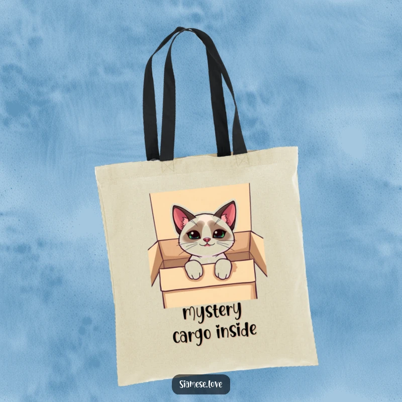Funny kawaii Siamese cat tote bag, peeking out of a box with a mischievous grin, perfect for carrying everyday items.